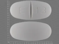 Pill with imprint E 13, white, oval, 22 mm (Levetiracetam 1000 mg)