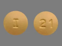 Pill with imprint I 21, yellow, round, 9 mm (Donepezil Hydrochloride 10 mg)