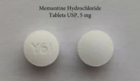 Pill with imprint Y61, white, round, 6 mm (Memantine Hydrochloride 5 mg)