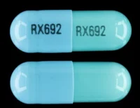 Pill with imprint RX692 RX692, blue & green, capsule, 19 mm (Clindamycin Hydrochloride 150 mg)