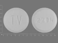 Pill with imprint TV 2204, white, round, 6 mm (Metoclopramide 5 mg)