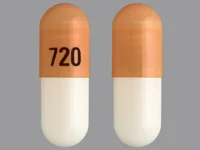 Pill with imprint 720, orange & white, capsule, 19 mm (Budesonide 3 mg)