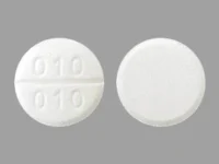 Pill with imprint 010 010, white, round, 13 mm (Aminocaproic Acid 500 mg)