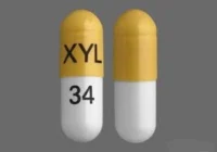 Pill with imprint XYL 34, white & yellow, capsule, 26 mm (Acetazolamide 500 mg)