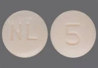 Pill with imprint NL 5, brown, round, 7 mm (Nebivolol 5 mg)