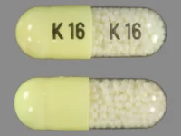 Pill with imprint K 16, white & yellow, capsule, 22 mm (Indomethacin 75 mg)