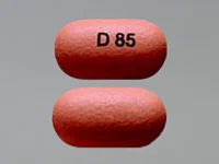 Pill with imprint D 85, orange, oval, 15 mm (Divalproex Sodium 250 mg)