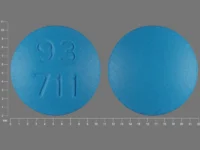 Pill with imprint 93 711, blue, round, 10 mm (Flurbiprofen 100 mg)