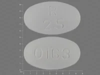 Pill with imprint R 2 5 0163, white, oval, 8 mm (Olanzapine 2.5 mg)
