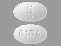 Pill with imprint R5 0164, white, oval, 8 mm (Olanzapine 5 mg)