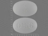 Pill with imprint R10 0166, white, oval, 10 mm (Olanzapine 10 mg)