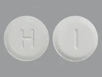 Pill with imprint H I, white, round, 5 mm (Roflumilast 500 mcg)