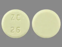 Pill with imprint ZC 26, yellow, round, 8 mm (Meloxicam 15 mg)