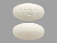 Pill with imprint 1127, white, oval, 15 mm (Ursodiol 250 mg)