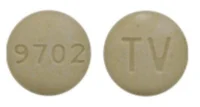 Pill with imprint TV 9702, yellow, round, 9 mm (Carbidopa and Levodopa Carbidopa Anhydrous 25 mg / Levodopa 100 mg)