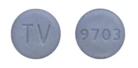 Pill with imprint TV 9703, blue, round, 10 mm (Carbidopa and Levodopa Carbidopa Anhydrous 25 mg / Levodopa 250 mg)