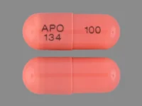 Pill with imprint APO 134 100, brown, capsule, 16 mm (Cyclosporine 100 mg)