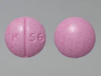 Pill with imprint K 56, pink, round, 6 mm (Oxycodone Hydrochloride 10 mg)