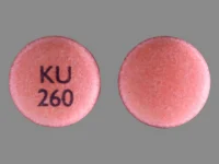 Pill with imprint KU 260, pink, round, 9 mm (Nifedipine 30 mg)