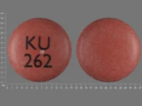 Pill with imprint KU 262, pink, round, 12 mm (Nifedipine 90 mg)