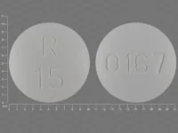 Pill with imprint R15 0167, white, round, 10 mm (Olanzapine 15 mg)