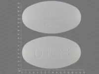 Pill with imprint R20 0168, white, oval, 15 mm (Olanzapine 20 mg)