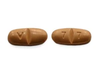 Pill with imprint V 7 7, brown, oval, 5 mm (Oxcarbazepine 300 mg)