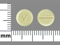 Pill with imprint 2530 V, yellow, round, 8 mm (Clonazepam 0.5 mg)
