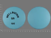 Pill with imprint WELLBUTRIN SR 100, blue, round, 10 mm (Bupropion Hydrochloride 100 mg)