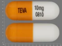 Pill with imprint TEVA 10mg 0810, orange & white, capsule, 16 mm (Nortriptyline Hydrochloride 10 mg)