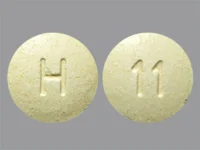 Pill with imprint H 11, yellow, round, 6 mm (Repaglinide 1 mg)