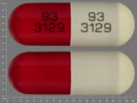 Pill with imprint 93 3129 93 3129, brown & red, capsule, 19 mm (Disopyramide Phosphate 150 mg)