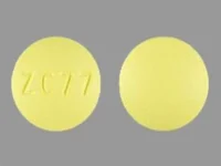 Pill with imprint ZC 77, yellow, round, 10 mm (Risperidone 3 mg)