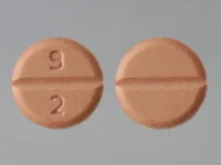 Pill with imprint 9 2, yellow, round, 6 mm (Pramipexole Dihydrochloride 0.25 mg)