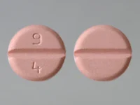Pill with imprint 9 4, pink, round, 8 mm (Pramipexole Dihydrochloride 1 mg)