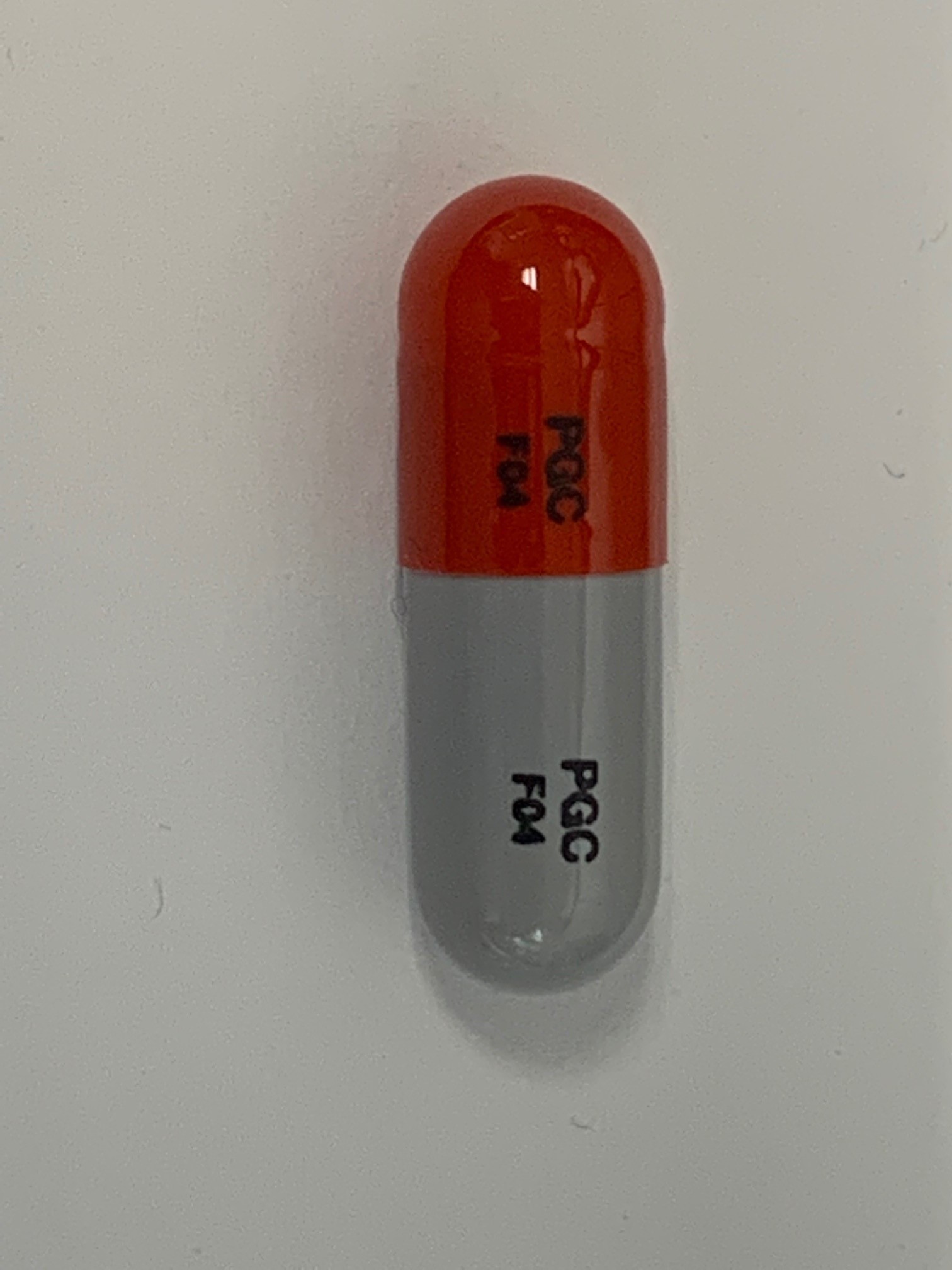 Pill with imprint PGC F04, gray & red, capsule, 20 mm (Cycloserine 250 mg)
