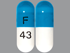 Pill with imprint F 43, blue & white, capsule, 14 mm (Atomoxetine 25 mg)