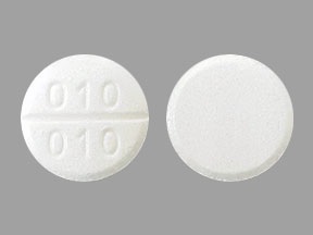Pill with imprint 010 010, white, round, 13 mm (Aminocaproic Acid 500 mg)
