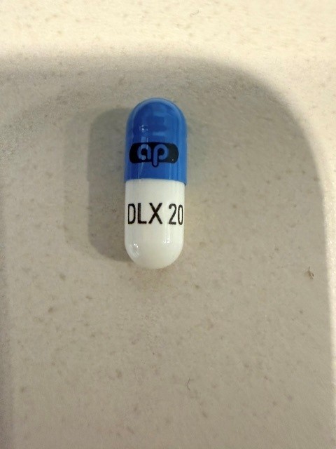 Pill with imprint DLX20 ap, blue & white, capsule, 14 mm (Duloxetine 20 mg)