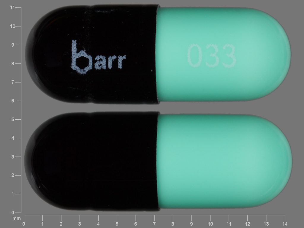 Pill with imprint barr 033, black & green, capsule, 14 mm (Chlordiazepoxide Hydrochloride 10 mg)