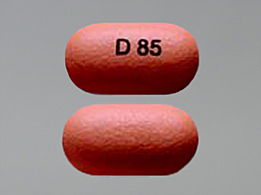 Pill with imprint D 85, orange, oval, 15 mm (Divalproex Sodium 250 mg)