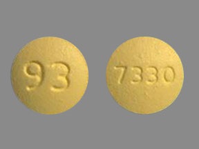 Pill with imprint 93 7330, yellow, round, 9 mm (Fenofibrate 54 mg)