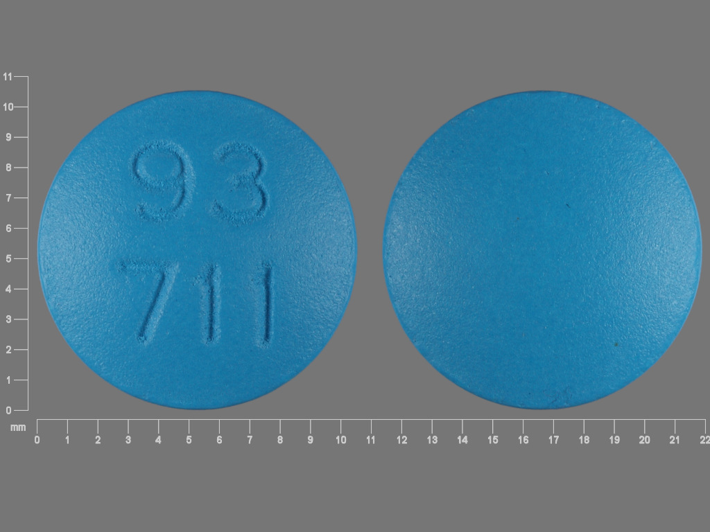 Pill with imprint 93 711, blue, round, 10 mm (Flurbiprofen 100 mg)