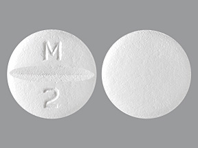 Pill with imprint M 2, white, round, 9 mm (Metoprolol Succinate 50 mg)