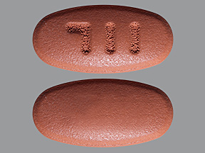 Pill with imprint 711, red, oval, 10 mm (Mesalamine 1.2 g)