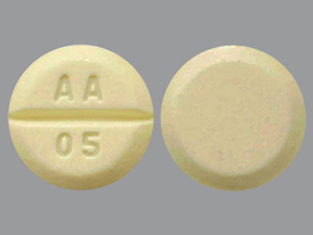 Pill with imprint AA 05, yellow, round, 6 mm (Phytonadione 5 mg)