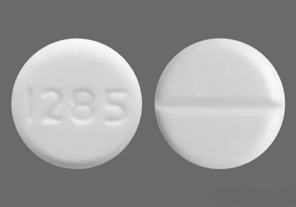 Pill with imprint 1285, white, round, 8 mm (Baclofen 10 mg)