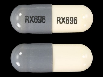 Pill with imprint RX696, gray & white, capsule, 18 mm (Minocycline Hydrochloride 100 mg)