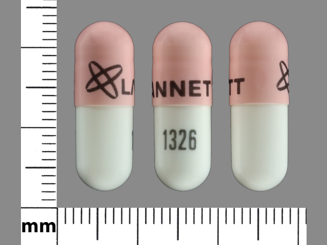 Pill with imprint LANNETT 1326, pink & white, capsule, 22 mm (Ursodiol 300 mg)