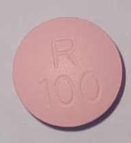 Pill with imprint R100, pink, round, 12 mm (Metoprolol Tartrate 100 mg)